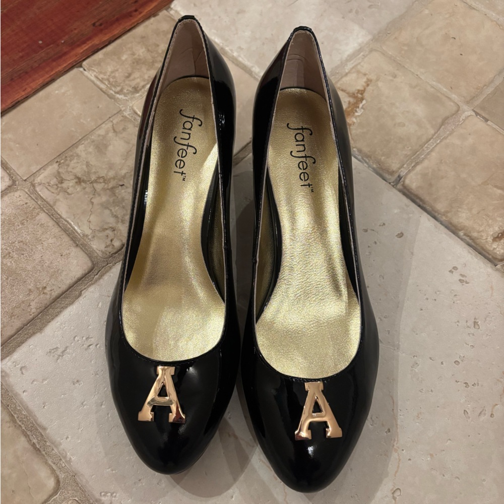 Womens black patent leather kitten heels.